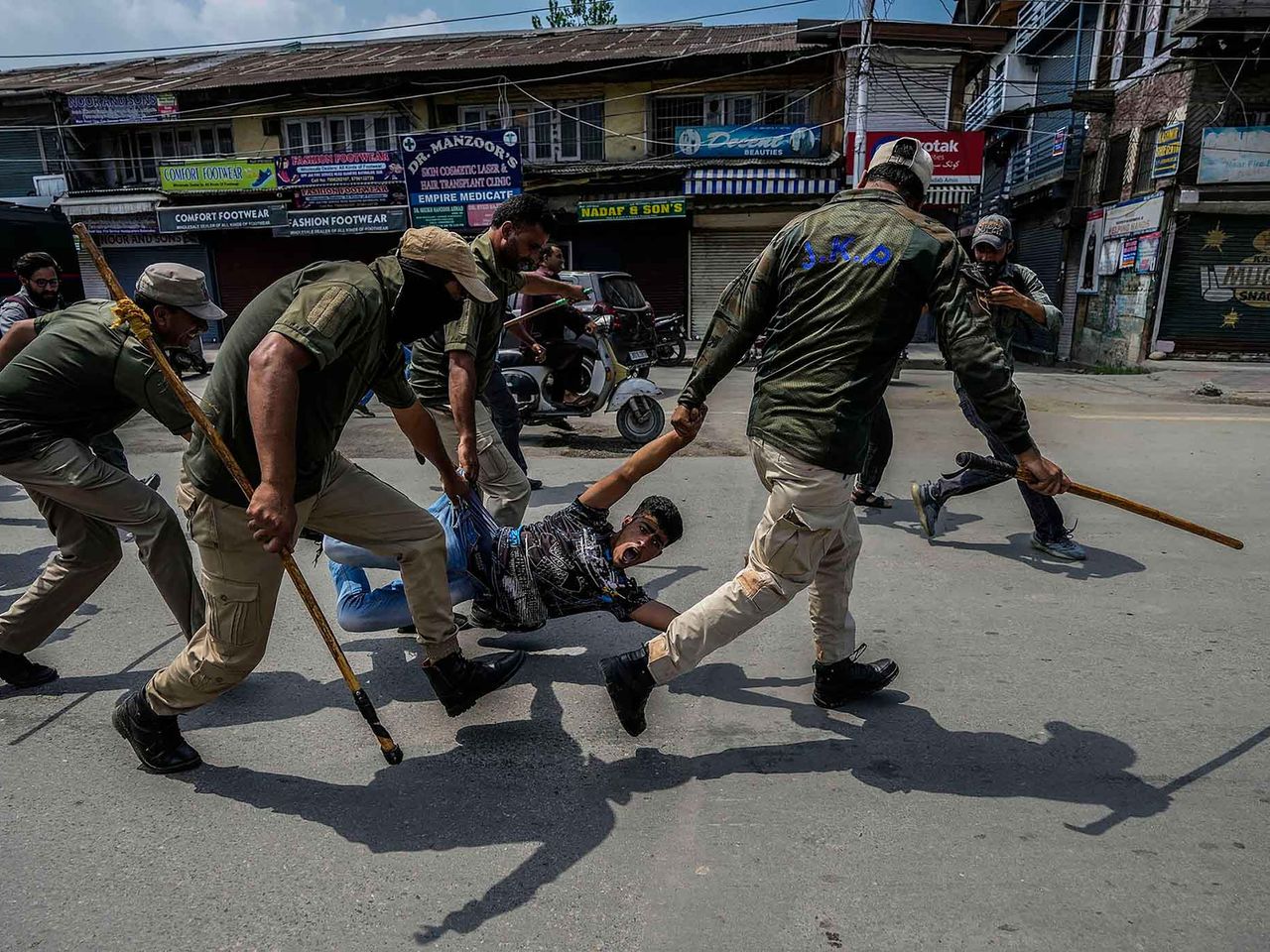 Indian policemen detain a Kashmiri Shiite Muslim for participating in a religious procession in Srinagar, Indian controlled Kashmir, Sunday, Aug. 7, 2022. This project documents ongoing unrest in the long-disputed region of Kashmir, dating back to 1947, when India and Pakistan gained independence from Britain. Both nations claim Kashmir in its entirety, and each administers a portion of the region. In Indian-administered Kashmir, rebels have been fighting Indian rule for decades, seeking to unite the territory, either under Pakistani rule or as an independent country. India says that Pakistan supports armed insurgency in Kashmir. Pakistan denies the charge, saying it provides moral and diplomatic support only.